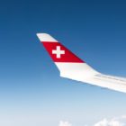 red and white airplane wings on sky